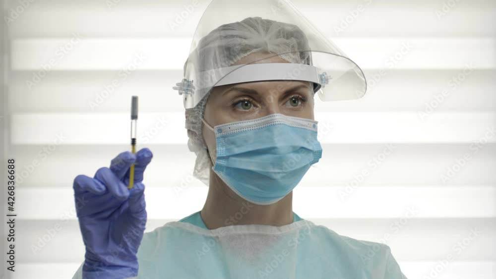 Portrait of a young nurse with a syringe ready to vaccinate a patient against covid 19. Portrait of a young nurse with a syringe ready to vaccinate a patient against covid 19.