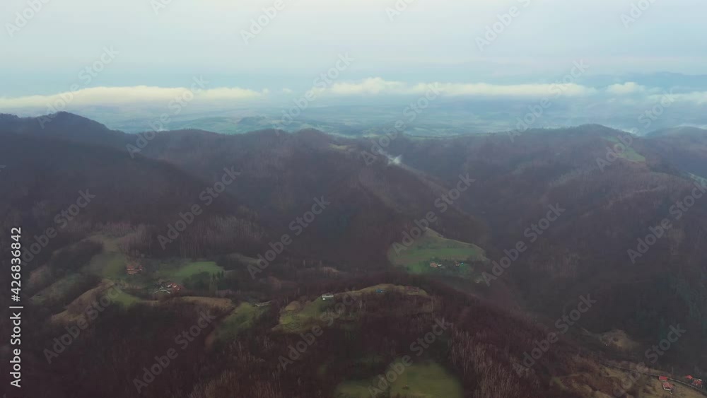 Aerial drone video of a mountain landscape in a cold foggy day Aerial drone video of a mountain landscape in a cold foggy day