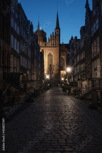 Night view of the githic St. Mary's church on Mariacka street, Gdańsk, Poland.