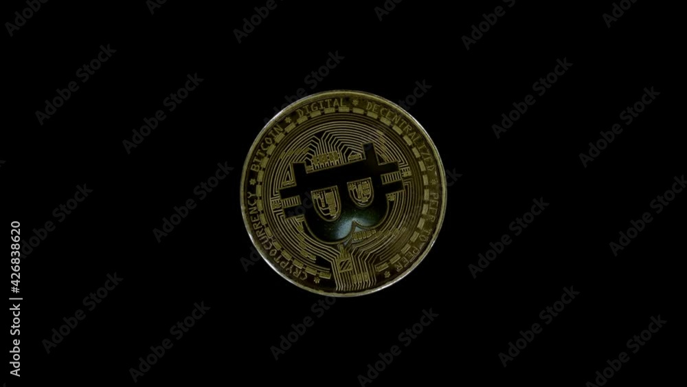 Golden color, metallic Bitcoin coin is glitters in the rays of light. Hodl, Hodler - Internet meme, slang name for those who buy cryptocurrencies and hold them. Macro. Closeup Golden color, metallic Bitcoin coin is glitters in the rays of light. Hodl, Hodler - Internet meme, slang name for those who buy cryptocurrencies and hold them. Macro. Closeup