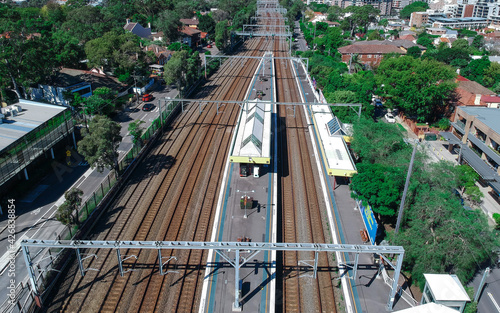 Photography Drone Aerial view of a train tracks in an inner suburb of Sydney with views of r