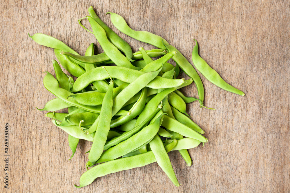 Heap green beans on wooden background. Heap green beans on wooden background.