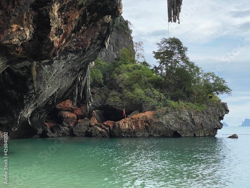 ornate limestone cliffs over sea at Railay beach in Krabi Thailand