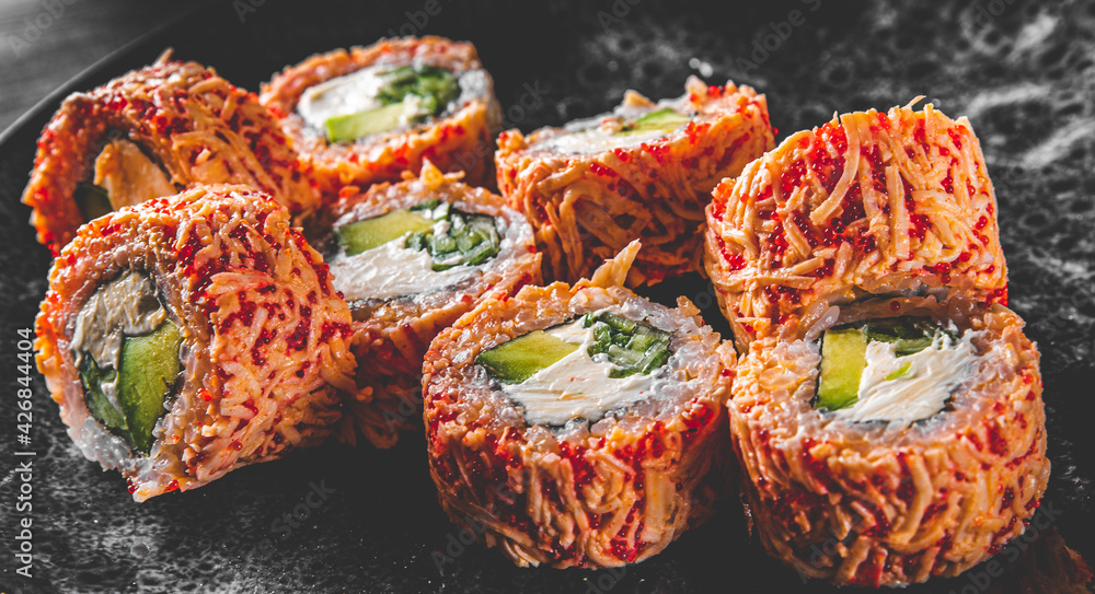 sushi roll in plate on wooden table background