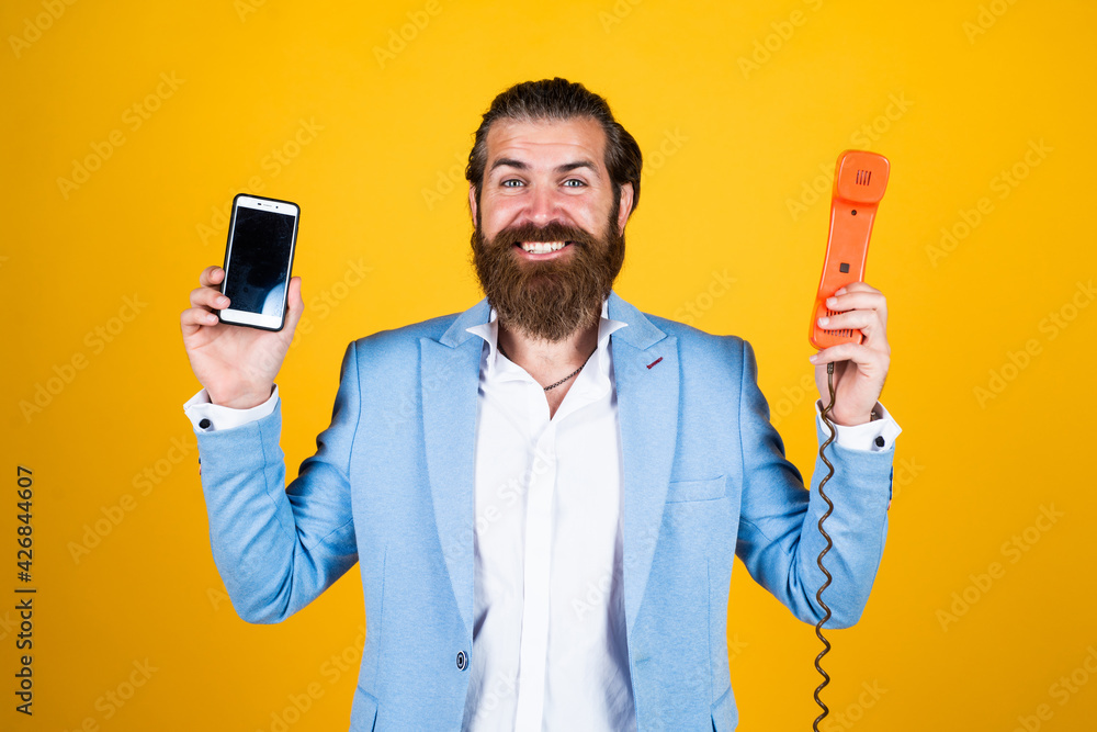 well groomed man in wedding formalwear has beard use retro phone and modern smartphone, modern life well groomed man in wedding formalwear has beard use retro phone and modern smartphone, modern life
