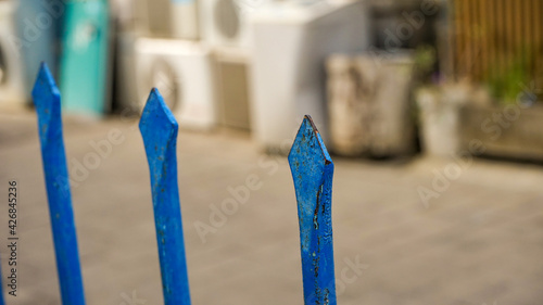 close up of blue umbrellas on the beach