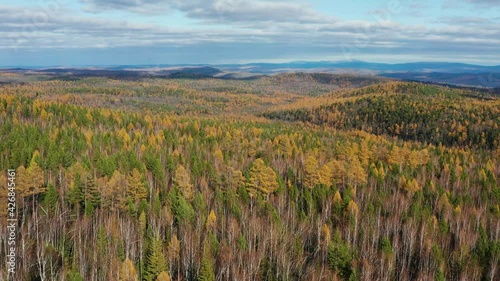 Eastern Siberia. Mountain taiga in autumn. Khamar-Daban ridge. Aerial view.