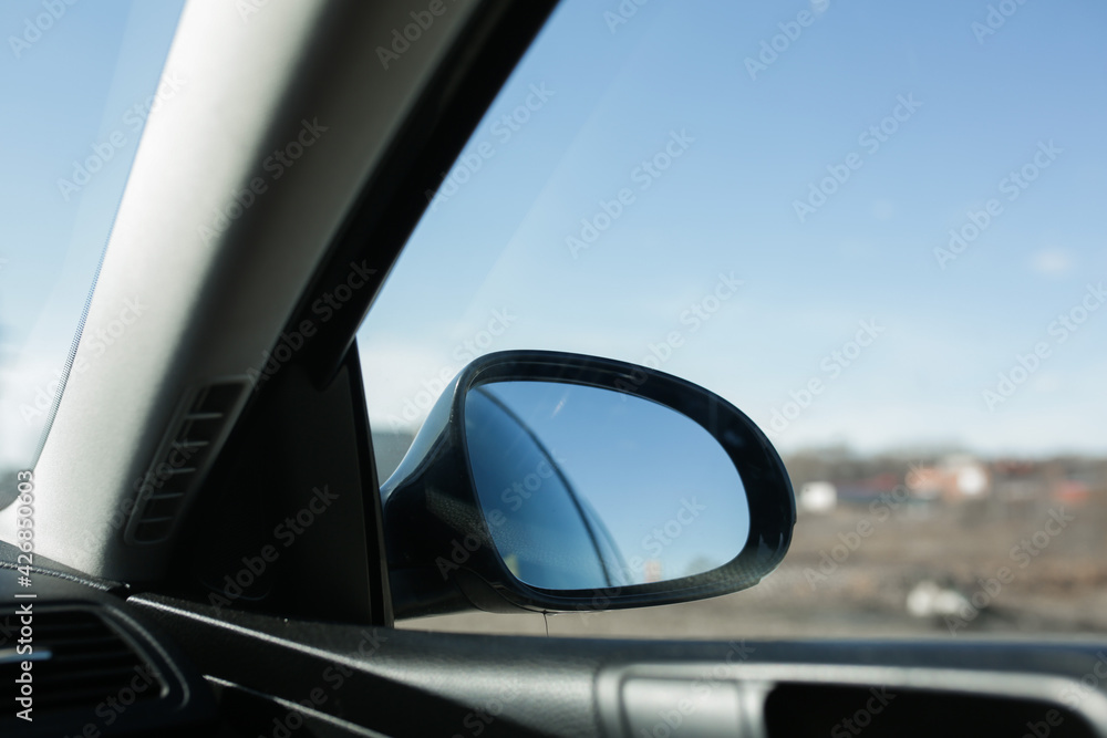 Rearview mirror, view from the car. Car door mirror.