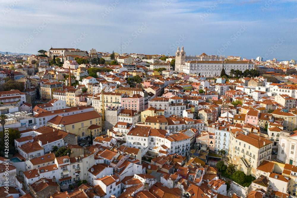 Aerial drone view over Alfama District, Lisbon, Portugal. Lockdown cityscape. National Pantheon in the background.