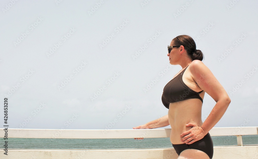 Foto Stock plus size curve full figured model on beach balcony in bikini  swimwear - resort style fashion lingerie | Adobe Stock