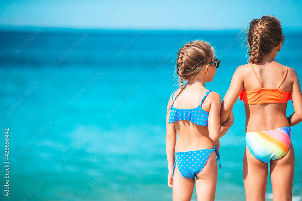 Adorable little girls having fun on the beach Adorable little girls having fun on the beach