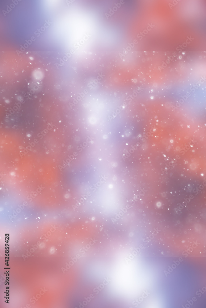 Fototapeta premium blurred snow / winter abstract background, snowflakes on abstract blurred glowing leaf background
