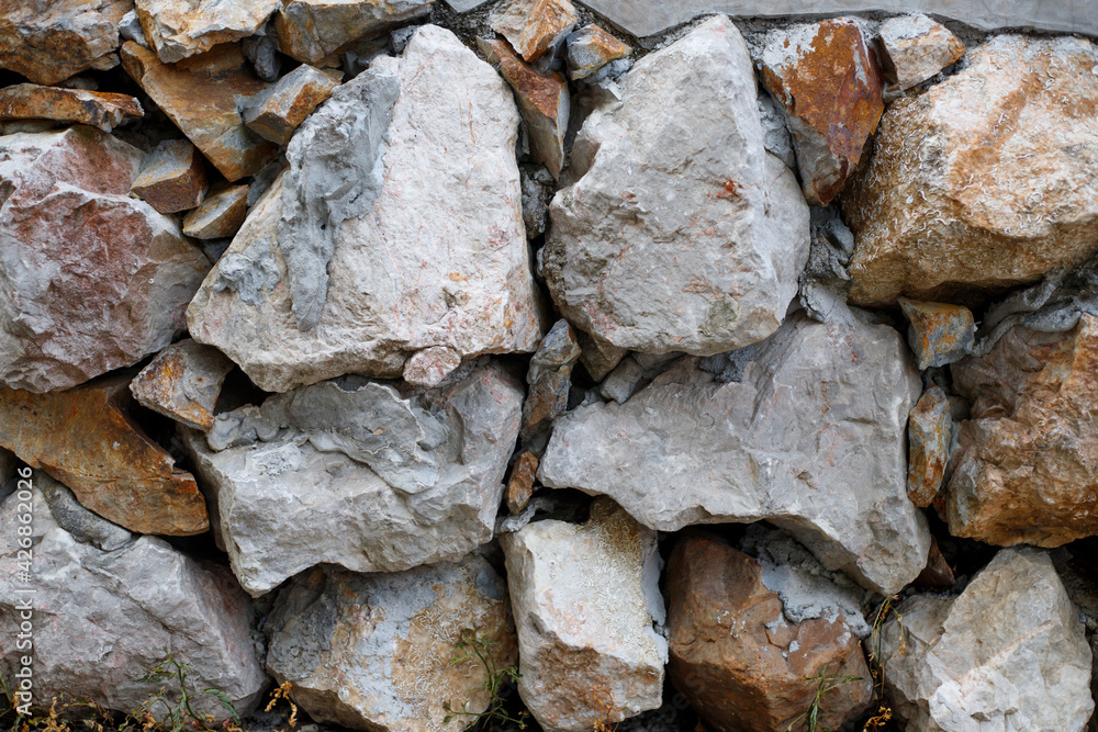 Arranged stone surface, rough wall texture background Arranged stone surface, rough wall texture background