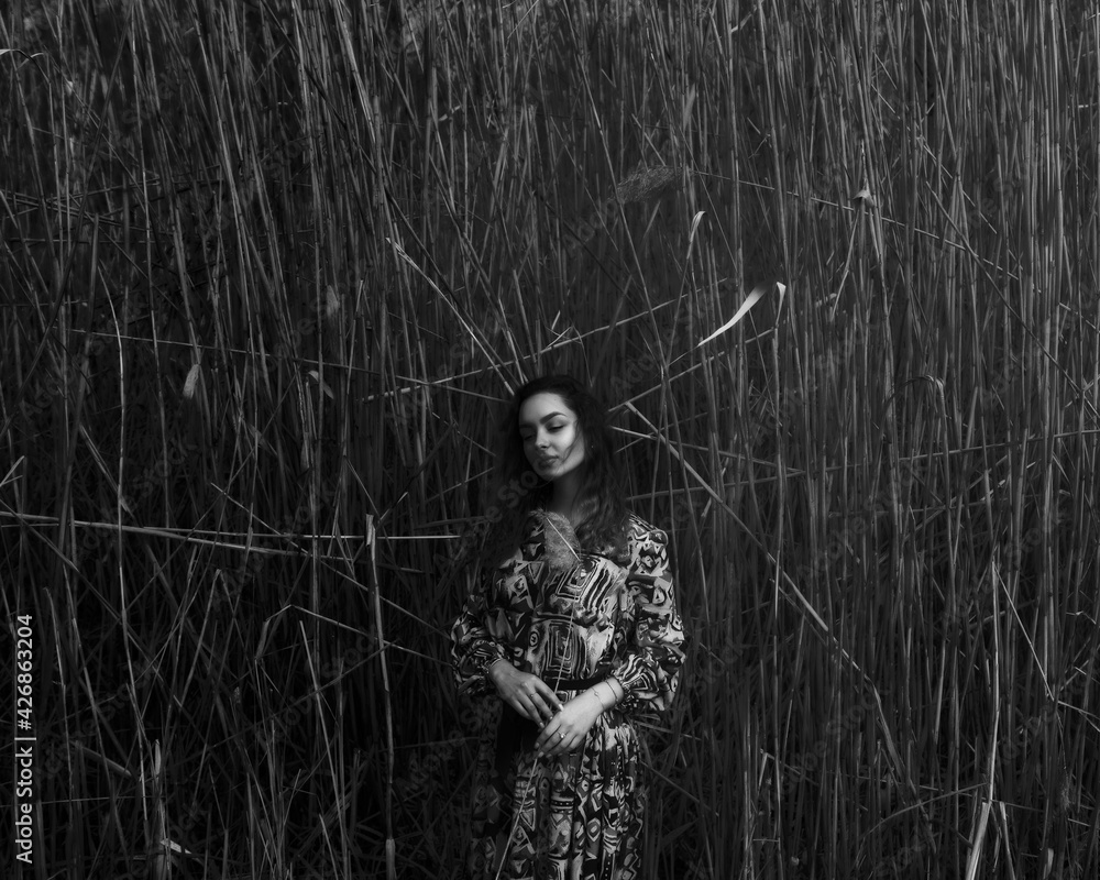 Black and white portrait of a girl near the river Black and white portrait of a girl near the river