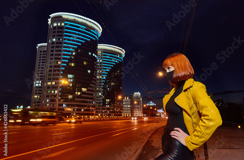 Girl with red hair in a cat woman mask