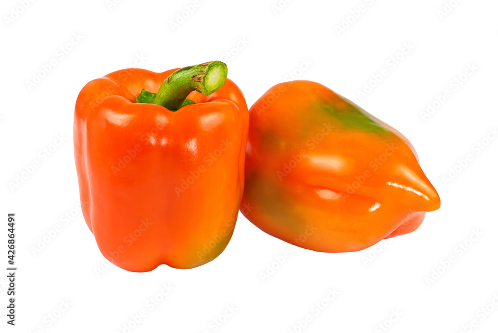Two orange bell peppers close up isolated on white background.