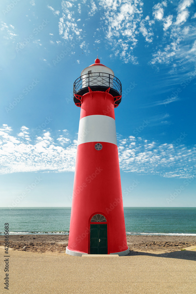 Fototapeta premium Red and white lighthouse on the sea coast