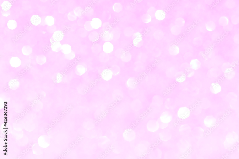 Shiny blurred pink background with bokeh for a festive mood. Greeting card template for entertainment.