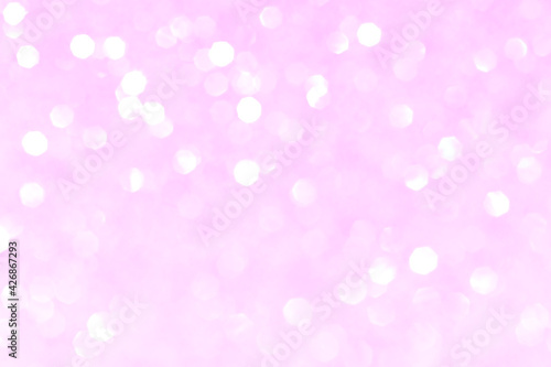 Shiny blurred pink background with bokeh for a festive mood. Greeting card template for entertainment.