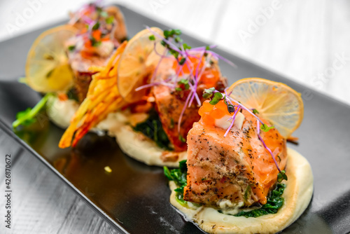 Canapes with smoked salmon, caviar and spinach
