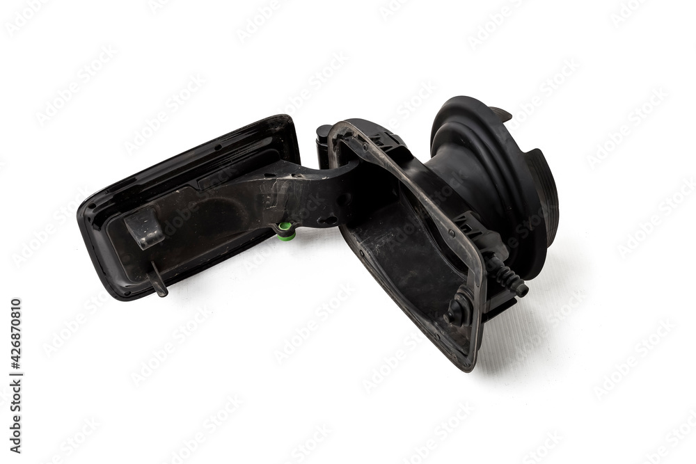 Detail of a black car body with rubber seal on a white isolated background in a photo studio gas tank cover spare part for sale at a car service or at an auto-parsing. Detail of a black car body with rubber seal on a white isolated background in a photo studio gas tank cover spare part for sale at a car service or at an auto-parsing.