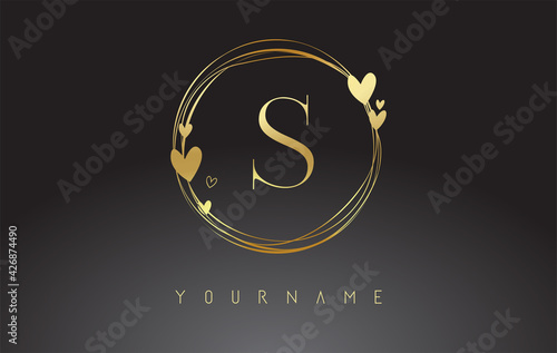 Letter S Logo with golden circle frames and golden hearts.