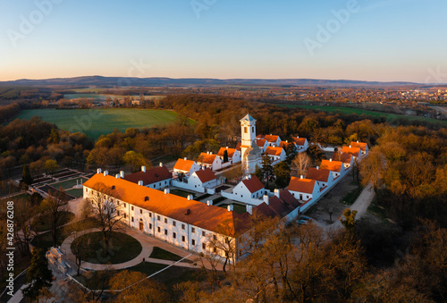 Majk, Hungary - The famous baroque Camaldolese monastery on a spring morning from drone point of view. Majk (or Majkpuszta) is a small village in the municipality of Oroszlány near Tatabánya. photo