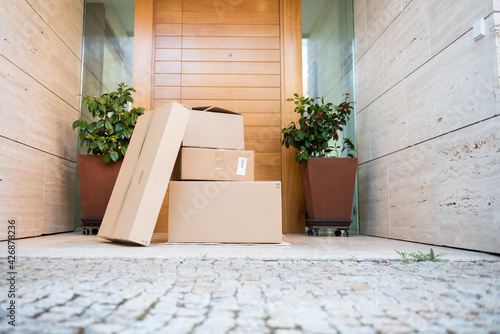 фотографія Several packages on the floor in front of the door