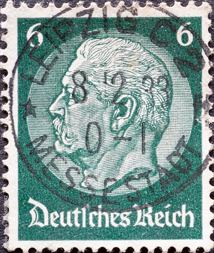 GERMANY - CIRCA 1933: a postage stamp from Germany, showing a portrait of the Reich President Paul von Hindenburg on a medallion. photo