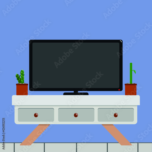 Sala de estar living mesa con televisión y plantas