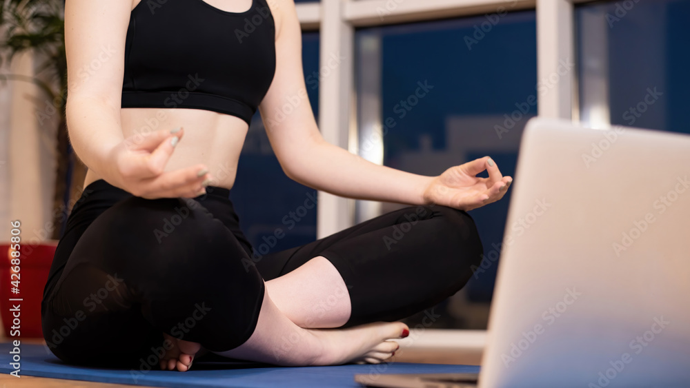 Young woman meditating at home Young woman meditating at home