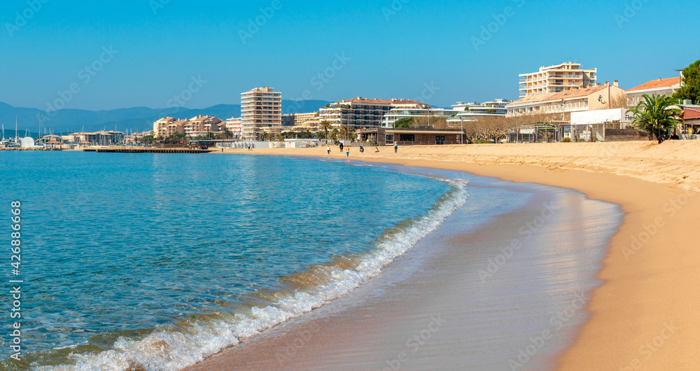 sandy beach and blue sea in Saint-Raphaël, on the French Riviera
