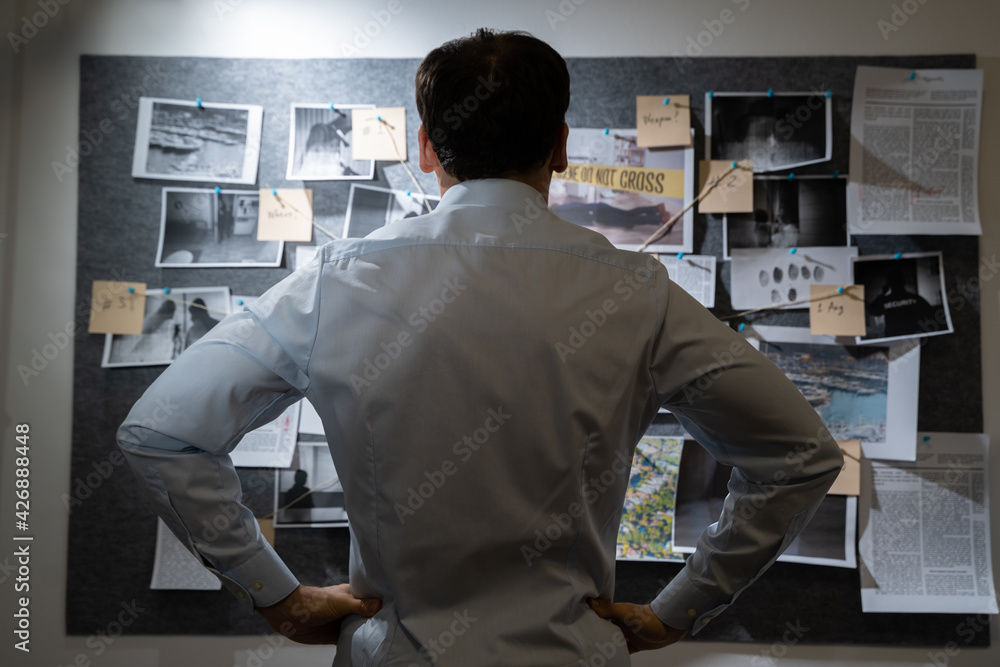 Policeman Searching Crime Investigation Board Policeman Searching Crime Investigation Board