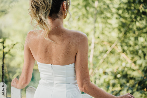 bride with freckles in her amazing luxury wedding dress white 