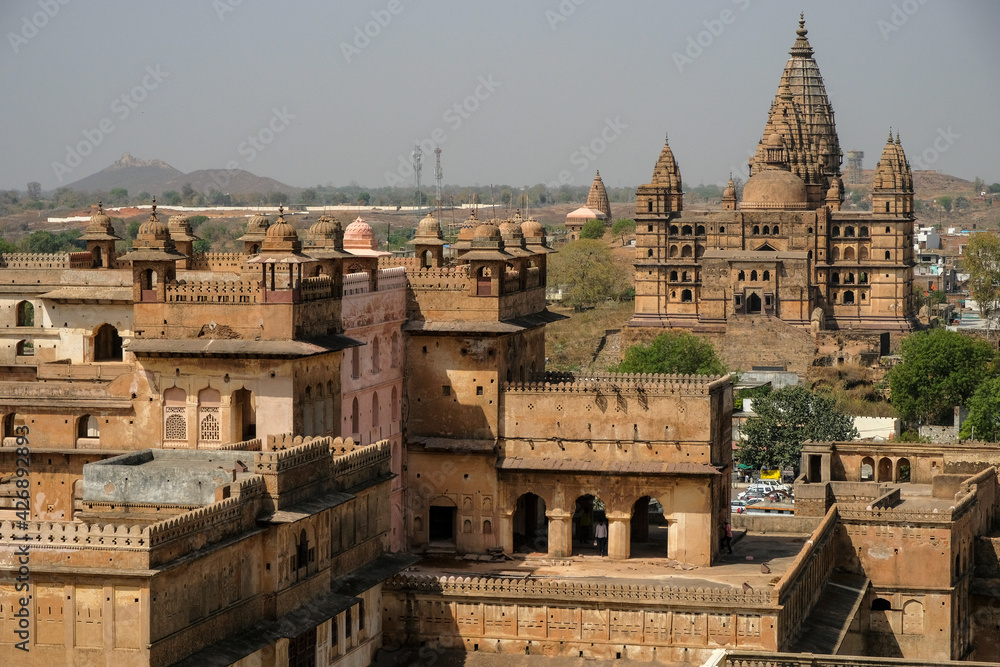 Detail of the Raj Mahal Palace with the temple of Chaturbhuj in the background in Orchha., Madhya Pradesh, India.