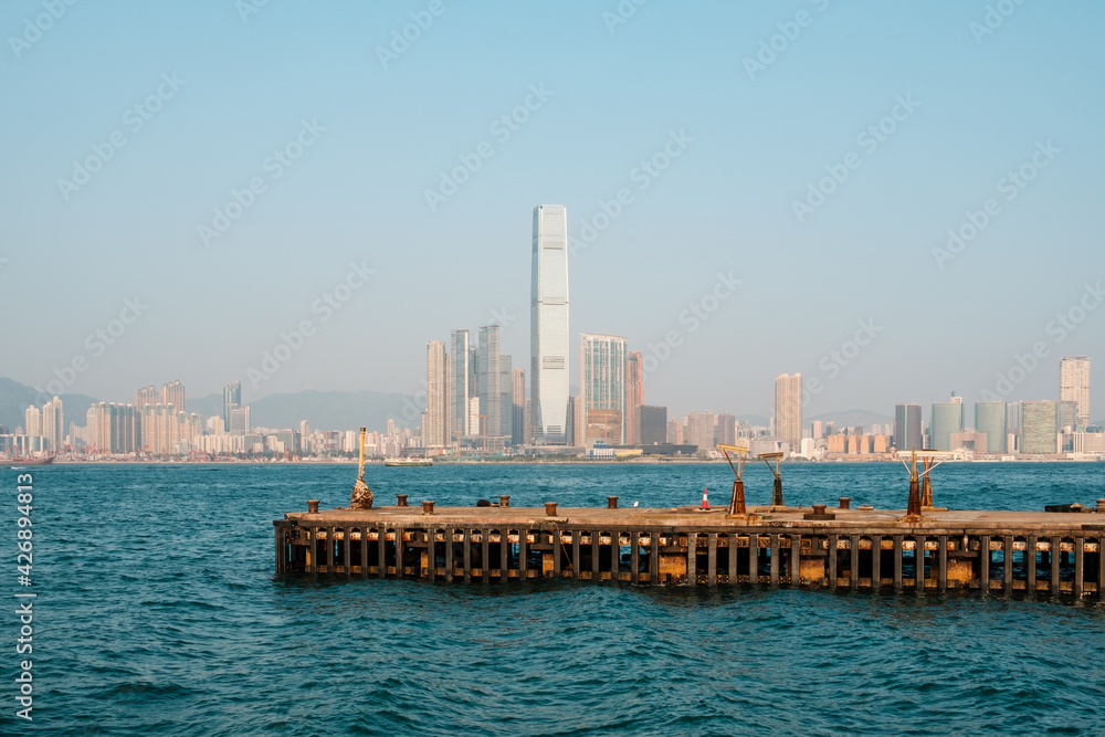 empty pier with ocean and scyscraper city skyline background, Hong Kong