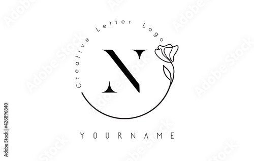 Creative initial letter N logo with lettering circle hand drawn flower element and leaf. photo