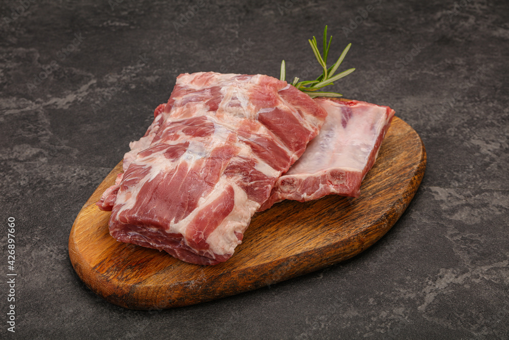Raw pork ribs served rosemary Raw pork ribs served rosemary