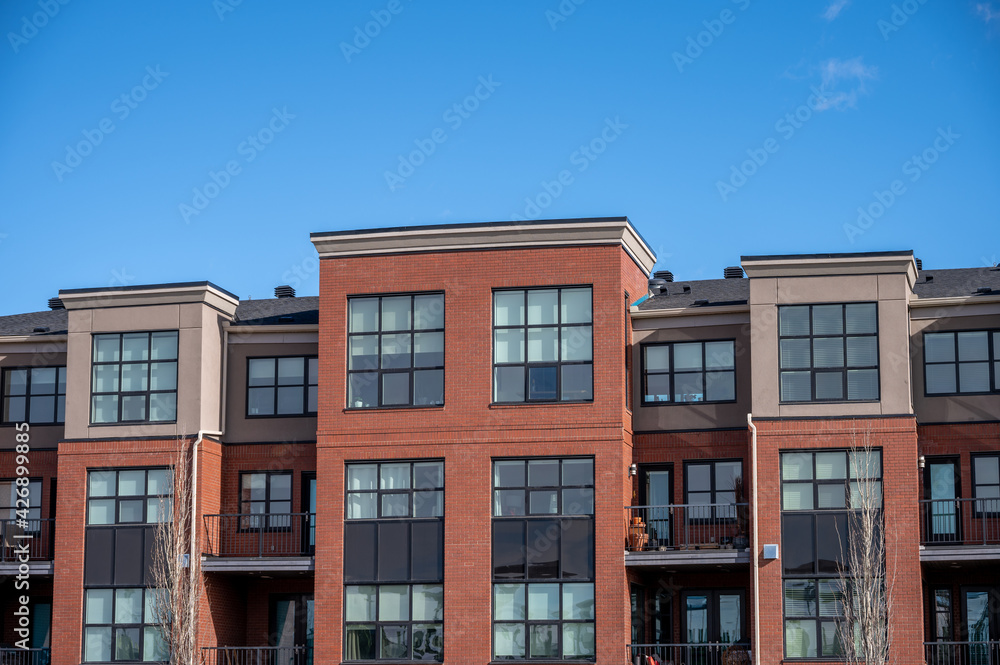 Modern condominium buildings in an urban environment. 