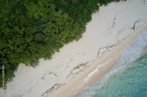 Aerial view of sea, sand and forest on Curieuse Island, Seychelles.