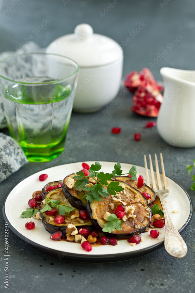 Fried eggplants with pomegranate sauce and nuts. Fried eggplants with pomegranate sauce and nuts.