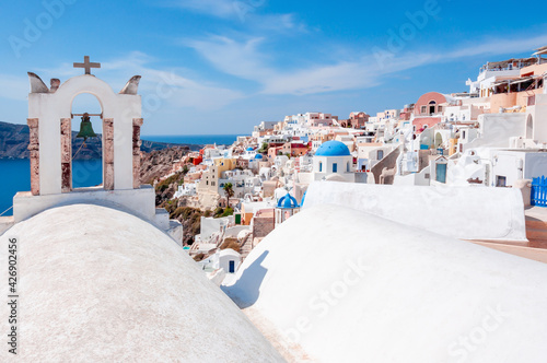 White houses and traditional church in Oia village, Santorini, Greece