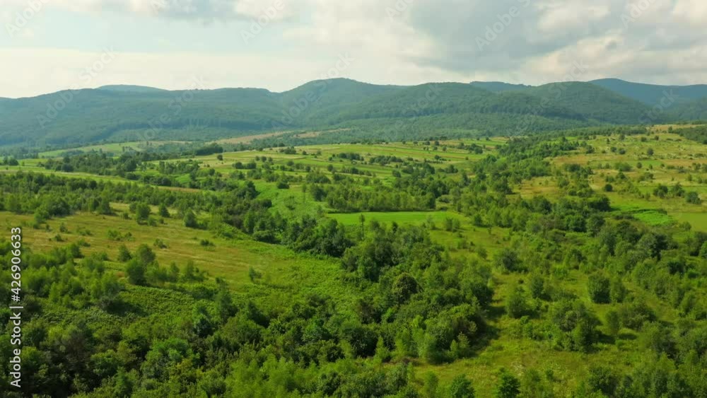 drone flying to the mountain above countryside landscape trees field meadow drone flying to the mountain above countryside landscape trees field meadow