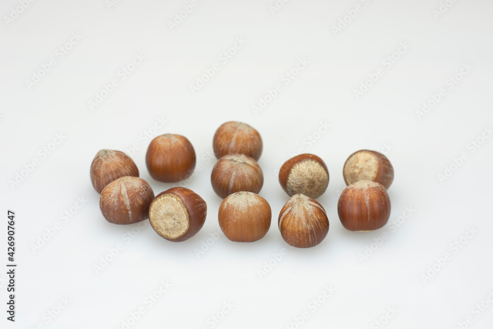 hazelnuts falling on white table
