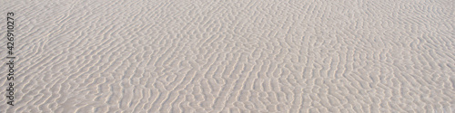 Tło, piasek morski, Falisty wzór. Abstrakcja
