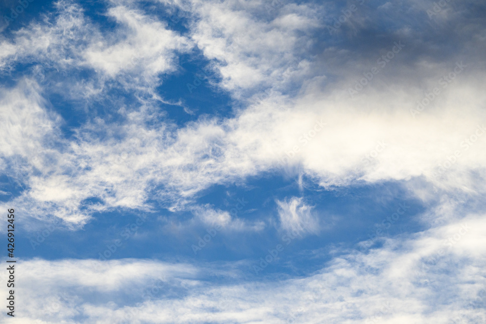 Light and airy cloudscape, white clouds and blue sky as a nature background
