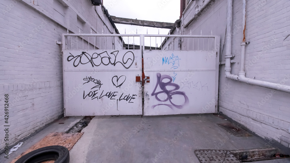 Graffiti about Love on an Industrial Gate Graffiti about Love on an Industrial Gate