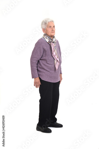 side view of a senir woman lookig on white background photo