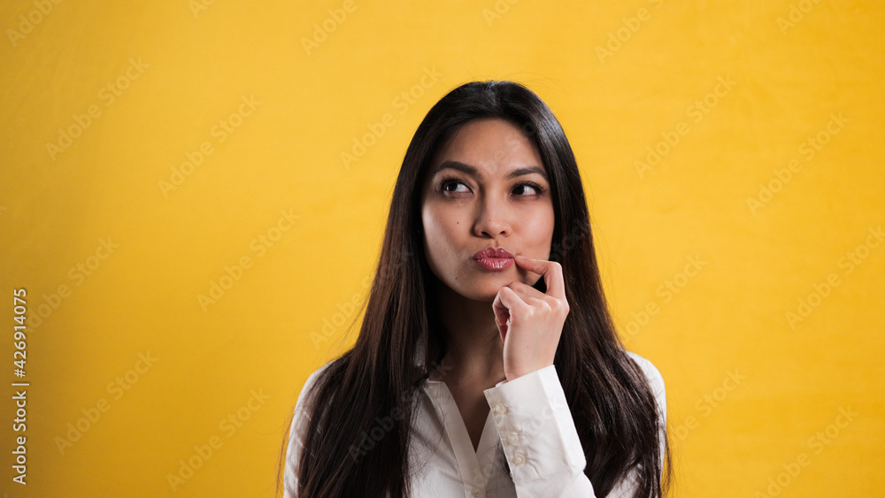 Young thoughtful woman has an idea - studio photography Young thoughtful woman has an idea - studio photography