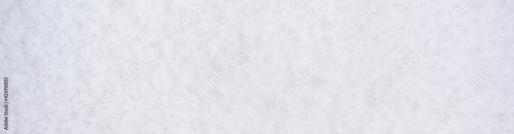 Fresh, wet, heavy snow, pattern and texture in white as a nature background
